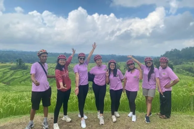 The Happy Trails! Asia team on a cycling tour through rice terraces